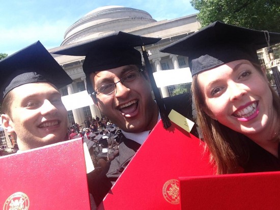 Class of 2015 MBAs Alex Smetannikov, Abhishek Syal, and Erica Swallow proudly display their diplomas after walking the stage at Commencement