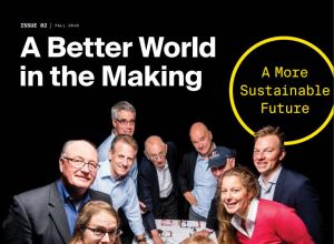 Campaign Newsletter cover. MIT Sloan professors playing the beer game.