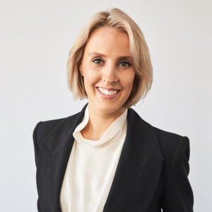 Headshot of Georgie Skipper wearing white shirt under black blazer